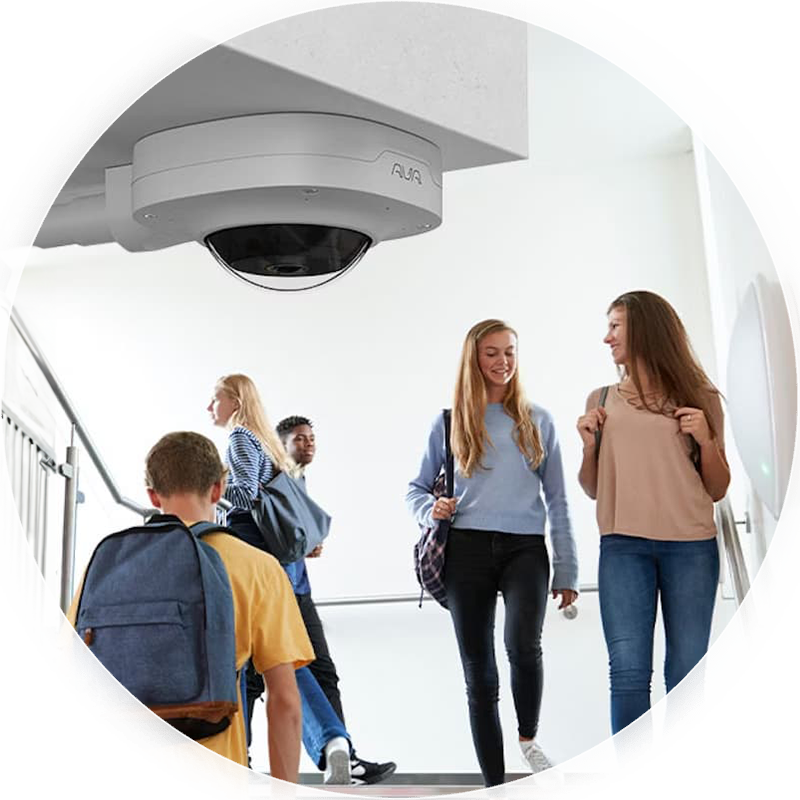 College students walking together in a hallway.