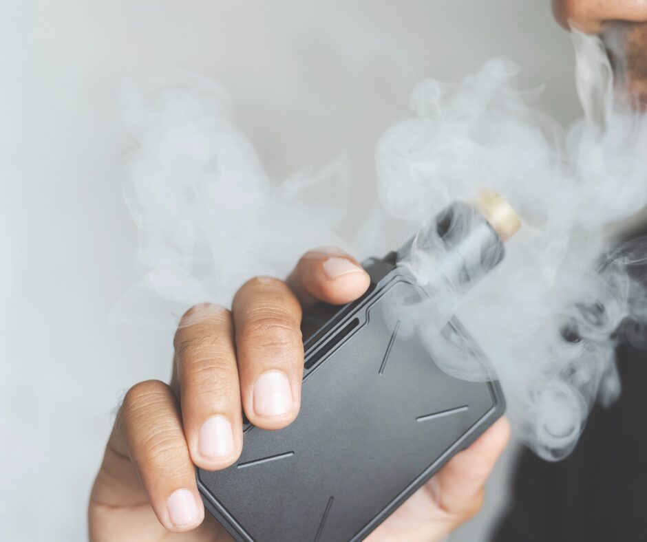 Close up of a person vaping.