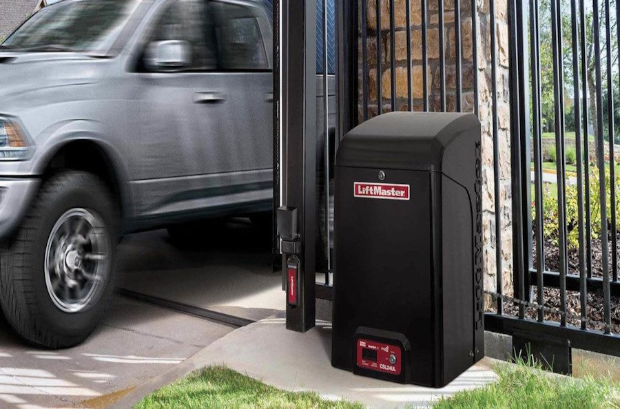 A sliding gate opens to admit entry to a truck.