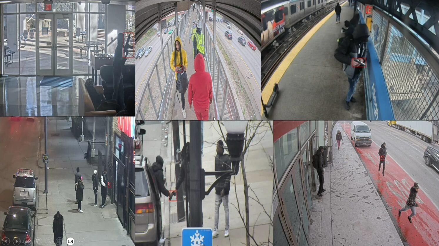 Person looking at security camera feed split into four screens on a desktop display.
