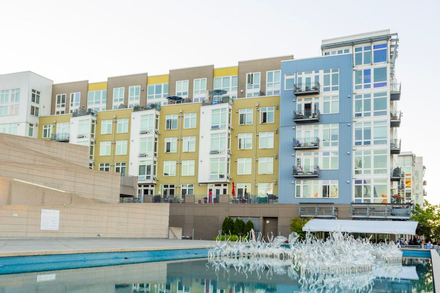 Modern multifamily apartment community with contemporary architecture and shared outdoor amenities.